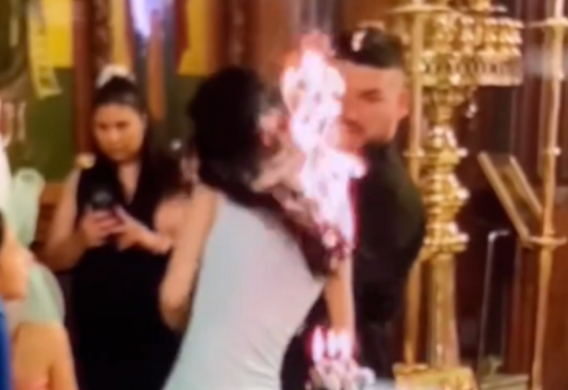GORE MREŽE Kuma se zapalila u crkvi tokom krštenja, snimak postao viralan (VIDEO)